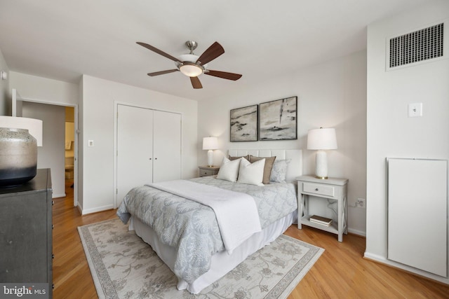 2555 Pennsylvania Ave NW Unit 918, Washington, DC 20037 - bedroom featuring light wood-style floors, a closet, and ceiling fan