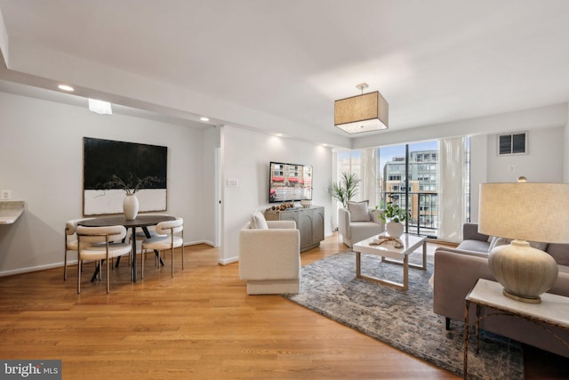 2555 Pennsylvania Ave NW Unit 918, Washington, DC 20037 - living area with light wood-style flooring and recessed lighting