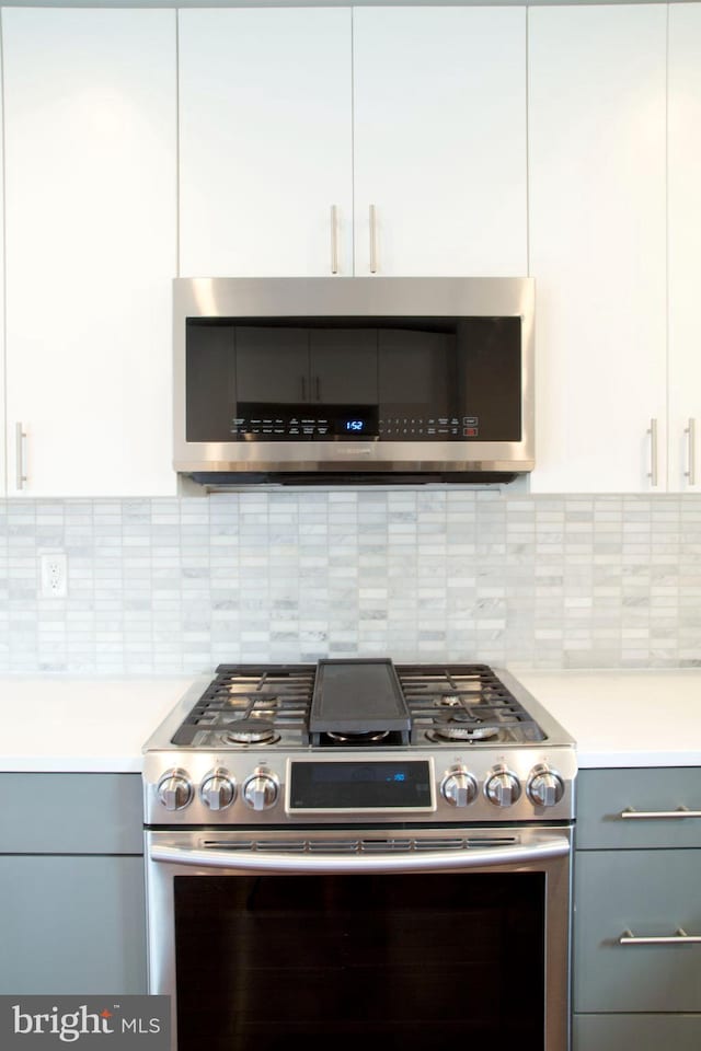 708 N 17th St, Philadelphia, PA 19130 - kitchen with appliances with stainless steel finishes, light countertops, gray cabinets, and white cabinets