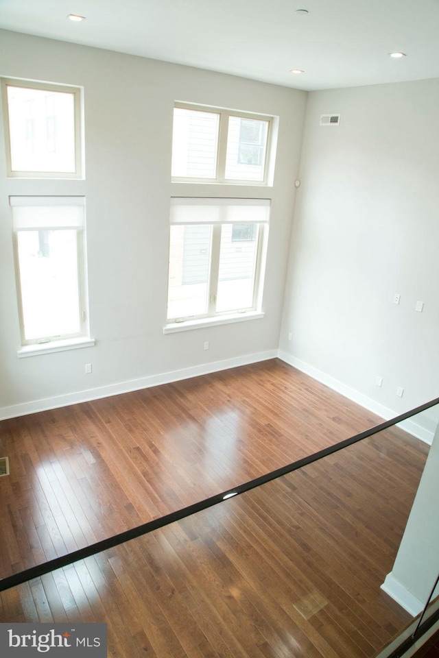 708 N 17th St, Philadelphia, PA 19130 - spare room with baseboards, plenty of natural light, and wood-type flooring
