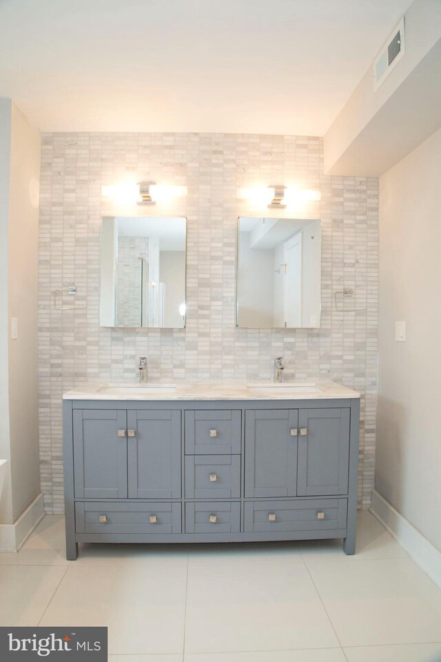 708 N 17th St, Philadelphia, PA 19130 - full bathroom with double vanity, tile patterned flooring, and baseboards
