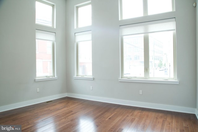 708 N 17th St, Philadelphia, PA 19130 - unfurnished room with healthy amount of natural light and dark wood-type flooring