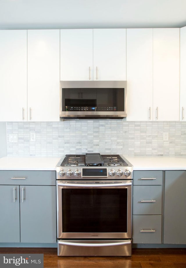 708 N 17th St, Philadelphia, PA 19130 - kitchen featuring stainless steel appliances, light countertops, gray cabinetry, and white cabinets