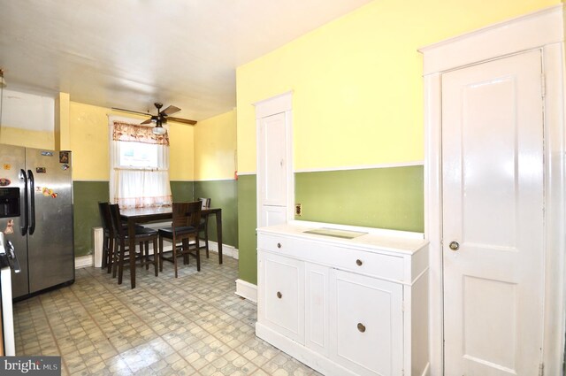 3324 Ryan Ave, Philadelphia, PA 19136 - kitchen featuring stainless steel fridge with ice dispenser, white cabinetry, a ceiling fan, light countertops, and light flooring