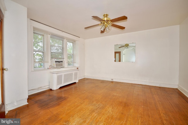 3324 Ryan Ave, Philadelphia, PA 19136 - empty room featuring radiator heating unit, wood finished floors, a ceiling fan, baseboards, and cooling unit