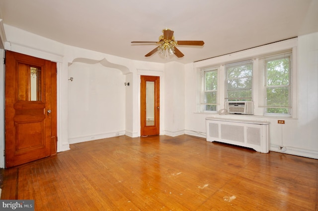3324 Ryan Ave, Philadelphia, PA 19136 - empty room featuring radiator, ceiling fan, wood finished floors, cooling unit, and baseboards