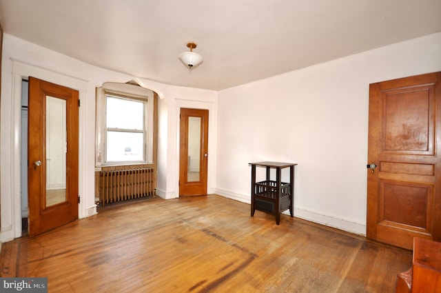 3324 Ryan Ave, Philadelphia, PA 19136 - entrance foyer with radiator heating unit, wood finished floors, and baseboards