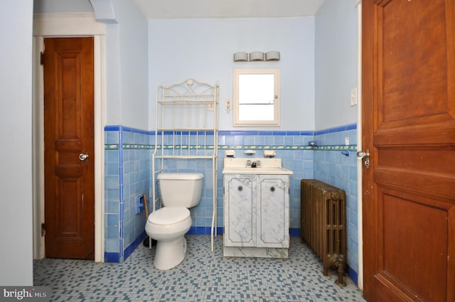 3324 Ryan Ave, Philadelphia, PA 19136 - bathroom featuring radiator, a wainscoted wall, tile patterned floors, vanity, and tile walls