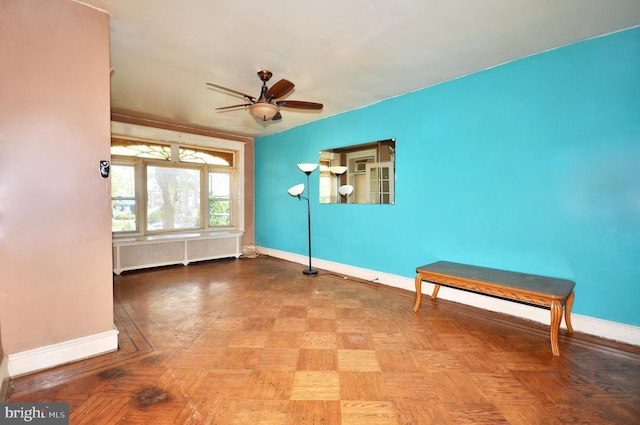 3324 Ryan Ave, Philadelphia, PA 19136 - empty room featuring radiator heating unit, baseboards, and a ceiling fan