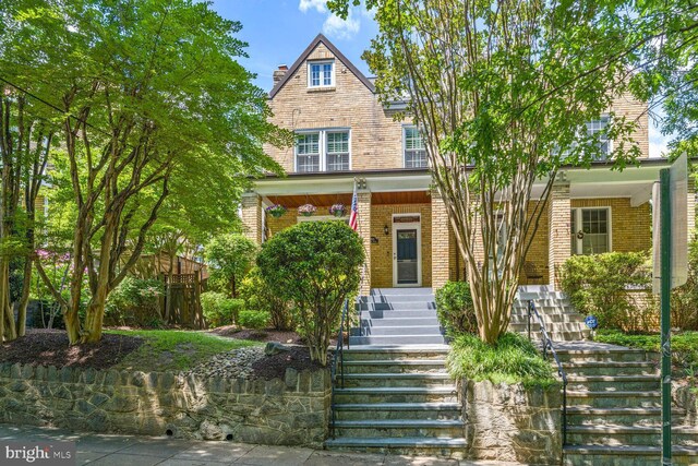 3805 Warren St NW, Washington, DC 20016 - view of front of home with stairway, brick siding, and a porch