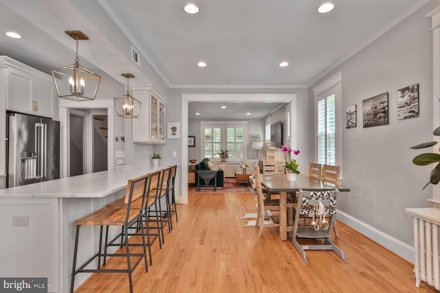 3805 Warren St NW, Washington, DC 20016 - dining room with baseboards, recessed lighting, light wood-type flooring, a chandelier, and ornamental molding