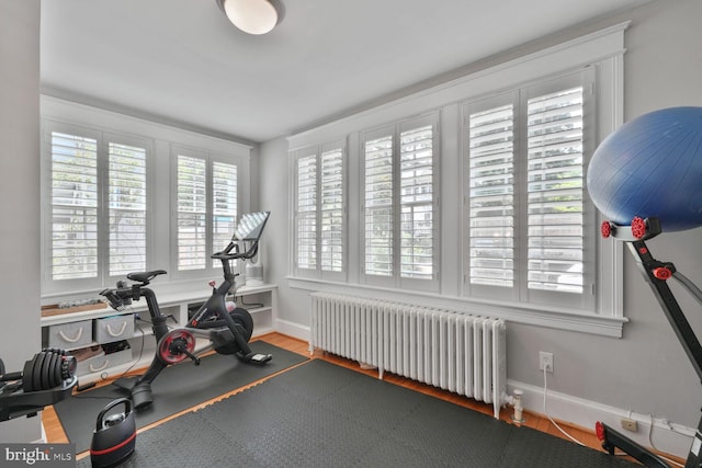 3805 Warren St NW, Washington, DC 20016 - workout area featuring radiator heating unit, baseboards, and wood finished floors
