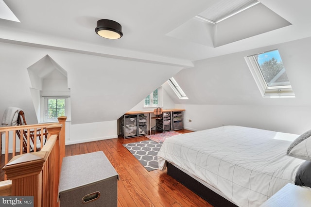 3805 Warren St NW, Washington, DC 20016 - bedroom with a skylight, wood-type flooring, lofted ceiling, and baseboards