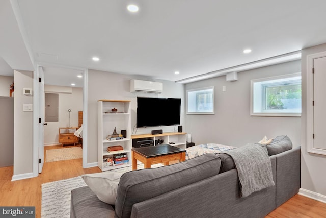 3805 Warren St NW, Washington, DC 20016 - living area featuring light wood-type flooring, electric panel, a wall mounted AC, baseboards, and recessed lighting