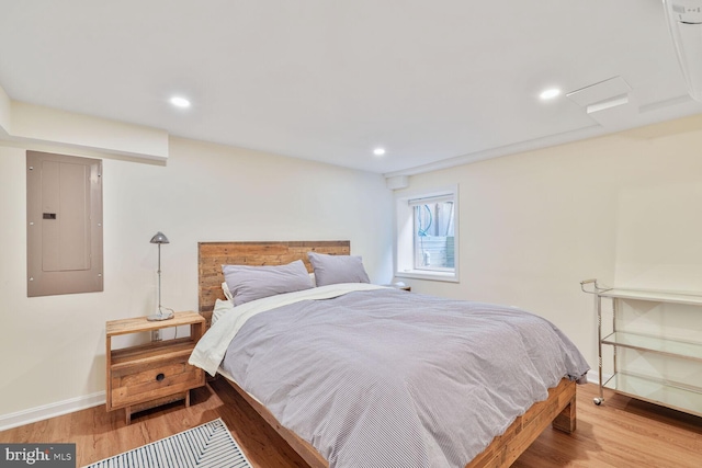 3805 Warren St NW, Washington, DC 20016 - bedroom featuring electric panel, wood finished floors, baseboards, and recessed lighting