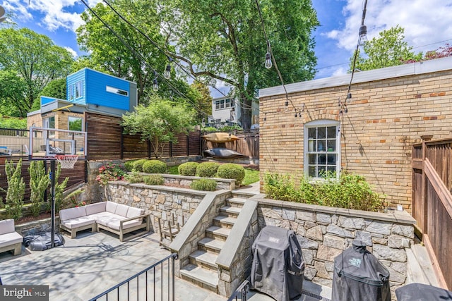3805 Warren St NW, Washington, DC 20016 - fenced backyard with a grill, a patio area, and an outdoor hangout area