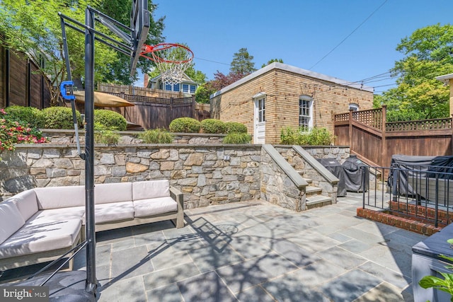 3805 Warren St NW, Washington, DC 20016 - fenced backyard with an outdoor living space, a patio area, and a grill