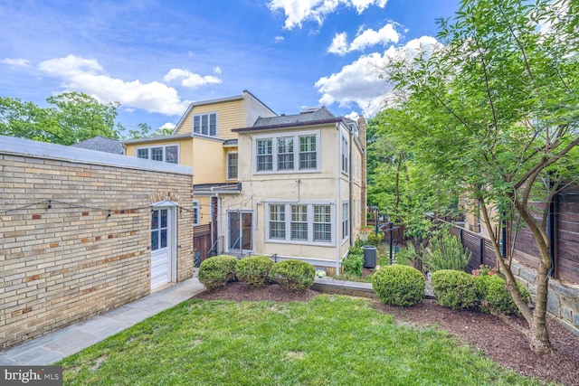 3805 Warren St NW, Washington, DC 20016 - view of front of home featuring stucco siding, a chimney, and central AC
