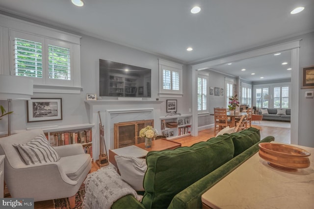 3805 Warren St NW, Washington, DC 20016 - living room featuring recessed lighting, a high end fireplace, ornamental molding, wood finished floors, and baseboards