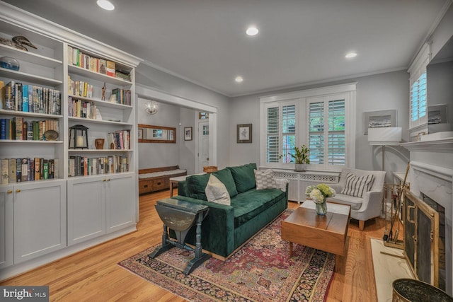 3805 Warren St NW, Washington, DC 20016 - living area featuring light wood-type flooring, ornamental molding, recessed lighting, a high end fireplace, and radiator