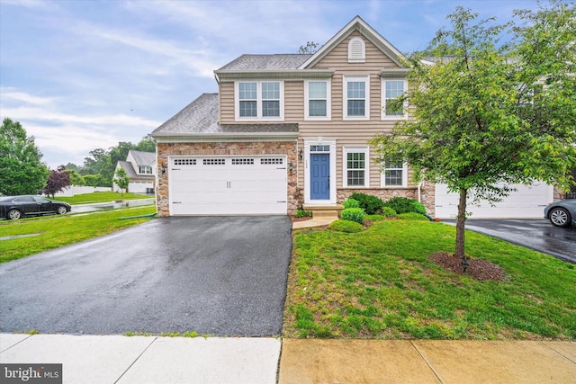 133 E General Grey Ct, Newark, DE 19702 - view of front facade featuring asphalt driveway, stone siding, a garage, and a front lawn