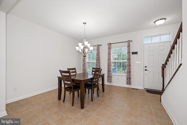 133 E General Grey Ct, Newark, DE 19702 - dining space with a chandelier, baseboards, stairs, and light tile patterned flooring