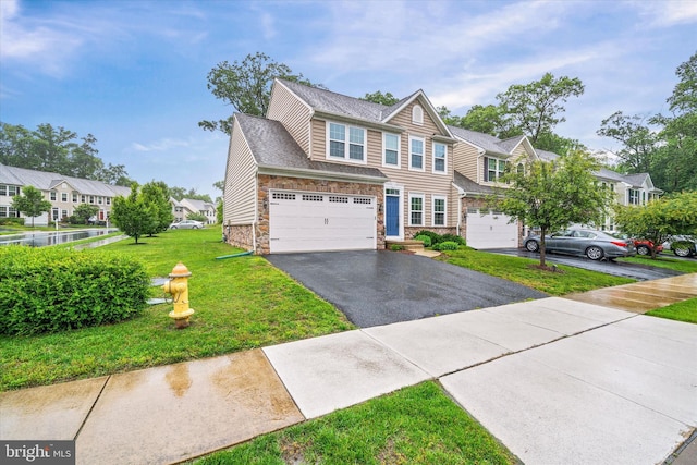 133 E General Grey Ct, Newark, DE 19702 - townhome / multi-family property featuring stone siding, asphalt driveway, a front lawn, a garage, and a residential view