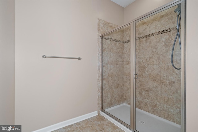 133 E General Grey Ct, Newark, DE 19702 - bathroom with a stall shower and baseboards