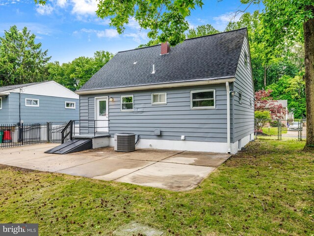 86 Summerfield Dr, Annapolis, MD 21403 - rear view of property featuring a patio area, central air condition unit, a chimney, and roof with shingles