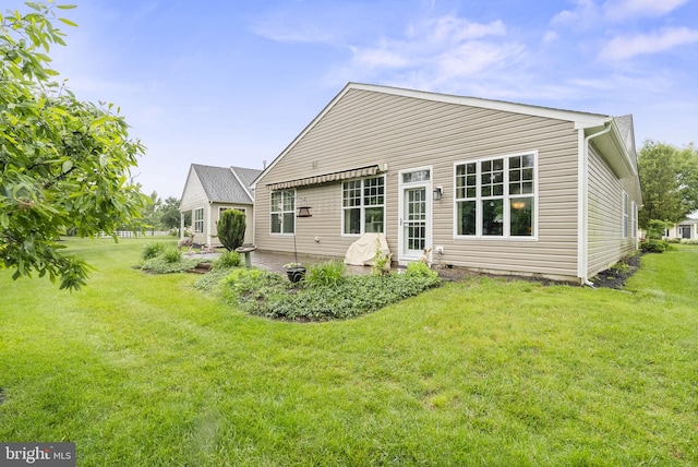 220 Wilshire Blvd, Woolwich Twp, NJ 08085 - back of house featuring a yard