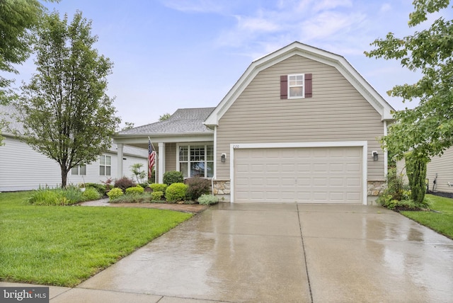 220 Wilshire Blvd, Woolwich Twp, NJ 08085 - dutch colonial featuring stone siding, concrete driveway, a front lawn, and an attached garage