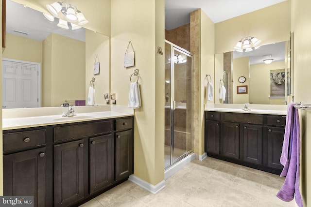 220 Wilshire Blvd, Woolwich Twp, NJ 08085 - full bath featuring a stall shower, two vanities, and tile patterned floors