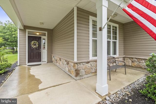 220 Wilshire Blvd, Woolwich Twp, NJ 08085 - entrance to property with a porch and stone siding
