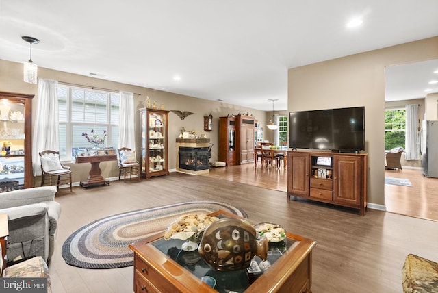 220 Wilshire Blvd, Woolwich Twp, NJ 08085 - living area with wood finished floors, recessed lighting, and a warm lit fireplace