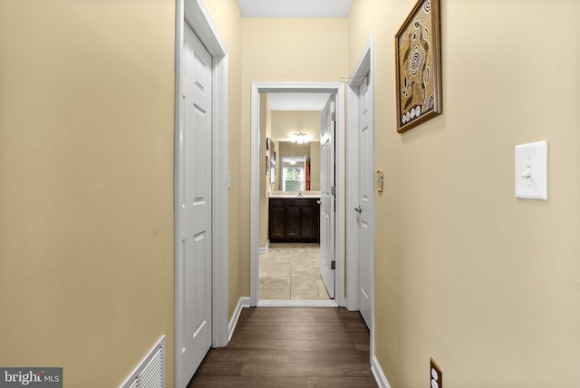 220 Wilshire Blvd, Woolwich Twp, NJ 08085 - hallway with dark wood-style flooring and baseboards