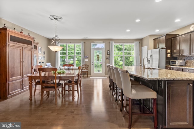 220 Wilshire Blvd, Woolwich Twp, NJ 08085 - kitchen featuring stainless steel fridge with ice dispenser, healthy amount of natural light, a kitchen breakfast bar, a sink, and recessed lighting
