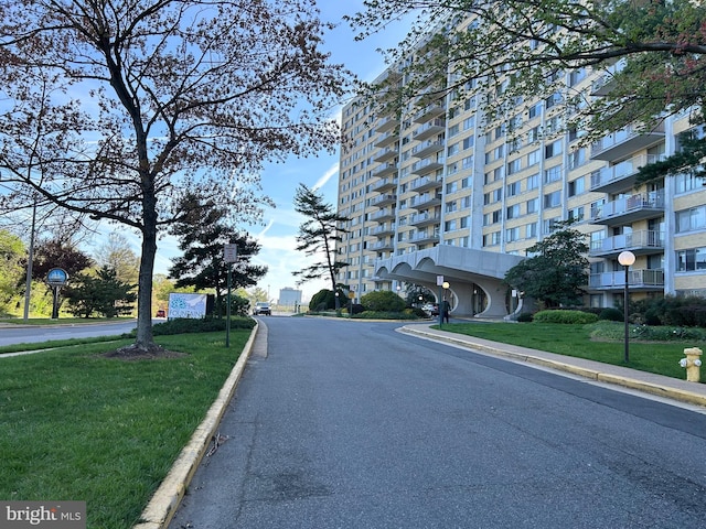 301 N Beauregard St Unit 905, Alexandria, VA 22312 - view of asphalt road featuring curbs, street lights, sidewalks, and traffic signs