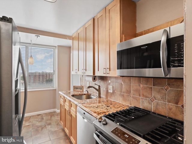 301 N Beauregard St Unit 905, Alexandria, VA 22312 - kitchen featuring appliances with stainless steel finishes, a sink, baseboards, decorative backsplash, and light brown cabinetry