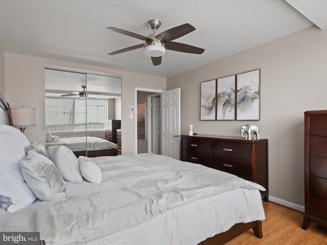 301 N Beauregard St Unit 905, Alexandria, VA 22312 - bedroom with light wood-style flooring, a closet, baseboards, and ceiling fan
