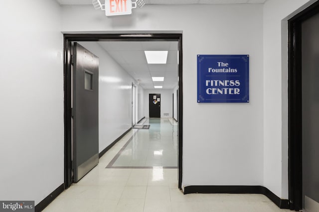 301 N Beauregard St Unit 905, Alexandria, VA 22312 - corridor with a drop ceiling, baseboards, and light tile patterned floors