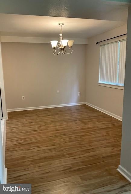 8485 Greenbelt Rd Unit 8485-T-1, Greenbelt, MD 20770 - spare room with a chandelier, baseboards, and wood finished floors