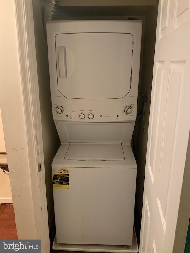 5514 Keyworth Ct, Capitol Heights, MD 20743 - washroom featuring stacked washer / drying machine and wood finished floors