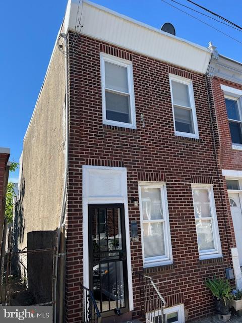1910 Mcclellan St, Philadelphia, PA 19145 - townhome / multi-family property featuring brick siding