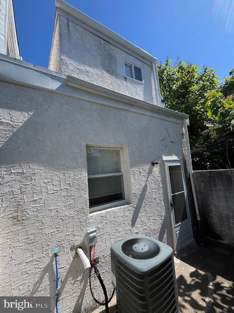 1910 Mcclellan St, Philadelphia, PA 19145 - exterior view of central AC unit and stucco siding