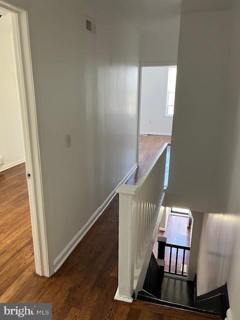 1910 Mcclellan St, Philadelphia, PA 19145 - hallway featuring an upstairs landing, wood finished floors, and baseboards
