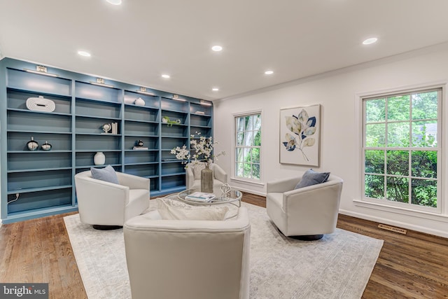 12209 Lake James Dr, Herndon, VA 20171 - living area with ornamental molding, wood finished floors, and recessed lighting