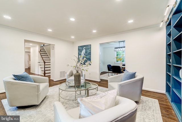 12209 Lake James Dr, Herndon, VA 20171 - living area featuring crown molding, stairs, wood finished floors, and recessed lighting