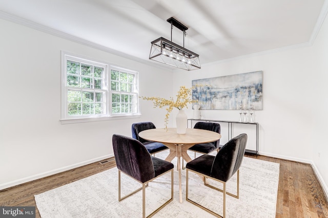 12209 Lake James Dr, Herndon, VA 20171 - dining space with crown molding, wood finished floors, and a chandelier