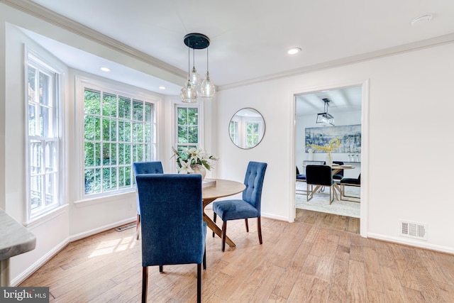 12209 Lake James Dr, Herndon, VA 20171 - dining room featuring healthy amount of natural light, light wood finished floors, ornamental molding, and recessed lighting