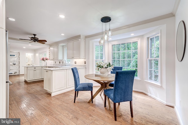 12209 Lake James Dr, Herndon, VA 20171 - dining space with ornamental molding, recessed lighting, light wood-style floors, and a ceiling fan